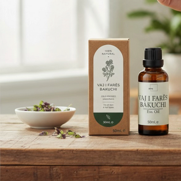 Septex Bakuchi seed oil in a brown glass dropper bottle with its natural kraft paper packaging on a wooden table.